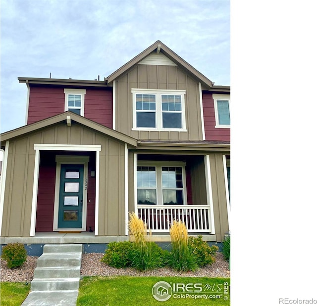 view of front facade featuring board and batten siding and a porch