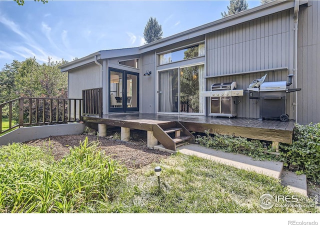 exterior space featuring french doors and a wooden deck