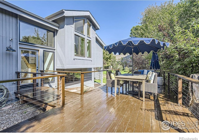 deck featuring outdoor dining space