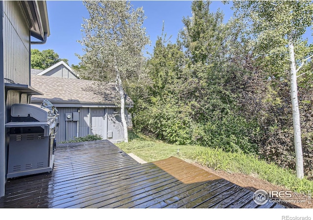 wooden deck featuring grilling area