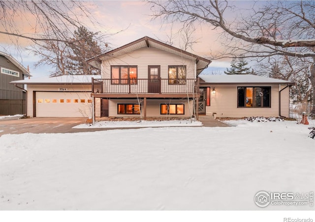 split level home with driveway and an attached garage