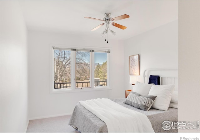 bedroom featuring carpet, baseboards, and ceiling fan