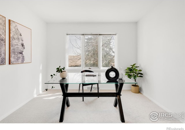 home office with carpet and baseboards