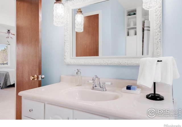 bathroom featuring ensuite bath, ceiling fan, and vanity