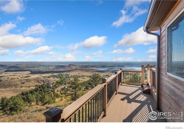 wooden terrace with a water view