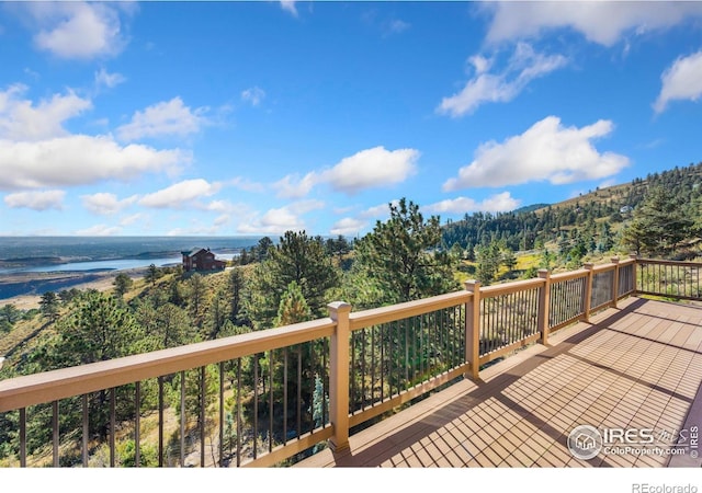 wooden deck featuring a water view