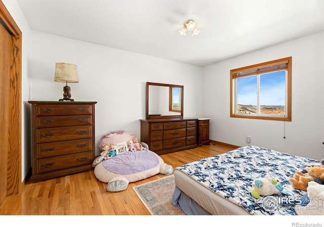 bedroom with light wood-style flooring