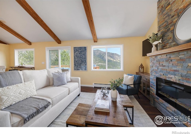 living area with baseboards, lofted ceiling with beams, a baseboard radiator, wood finished floors, and a fireplace