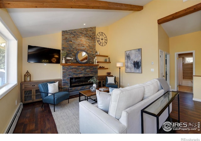 living room with plenty of natural light, a stone fireplace, baseboard heating, and wood finished floors