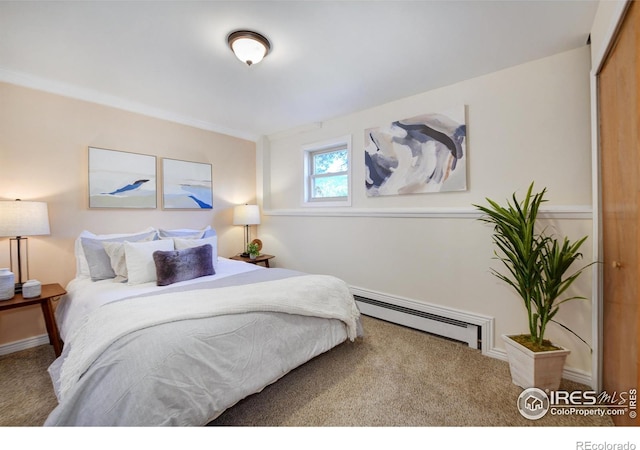 bedroom featuring a baseboard radiator and carpet flooring