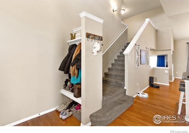 interior space featuring baseboards and wood finished floors