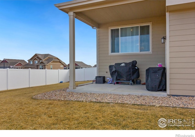 view of patio featuring fence