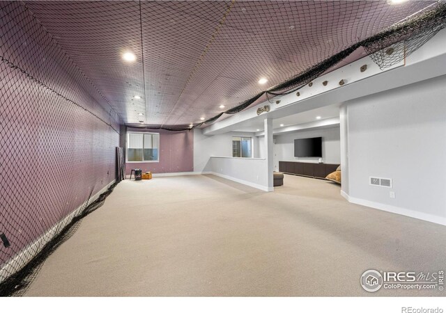 finished basement with recessed lighting, carpet flooring, visible vents, and baseboards