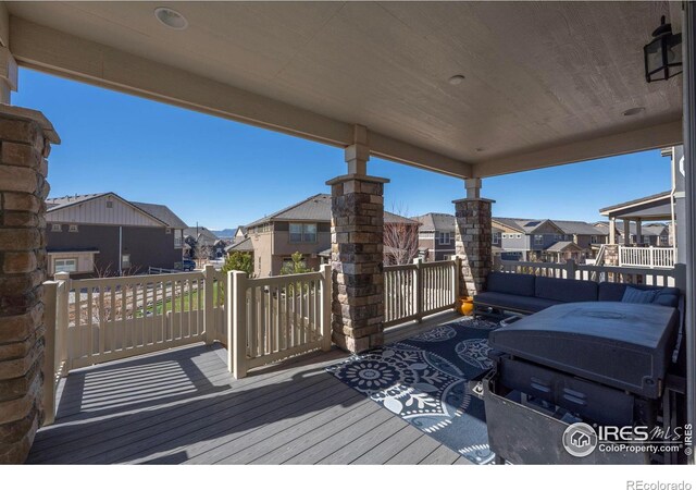 wooden terrace with a residential view