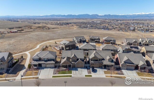 drone / aerial view with a mountain view and a residential view