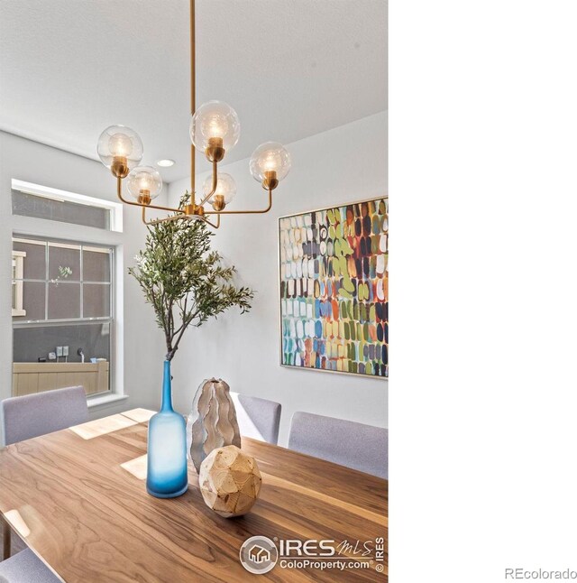 dining space featuring an inviting chandelier