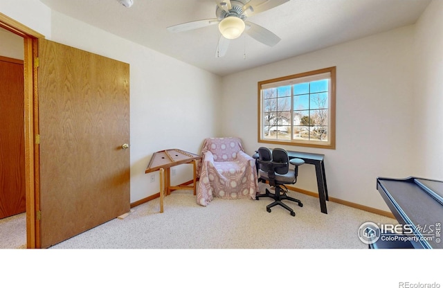 office featuring carpet floors, baseboards, and a ceiling fan