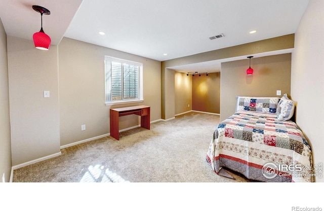 carpeted bedroom with recessed lighting, visible vents, and baseboards