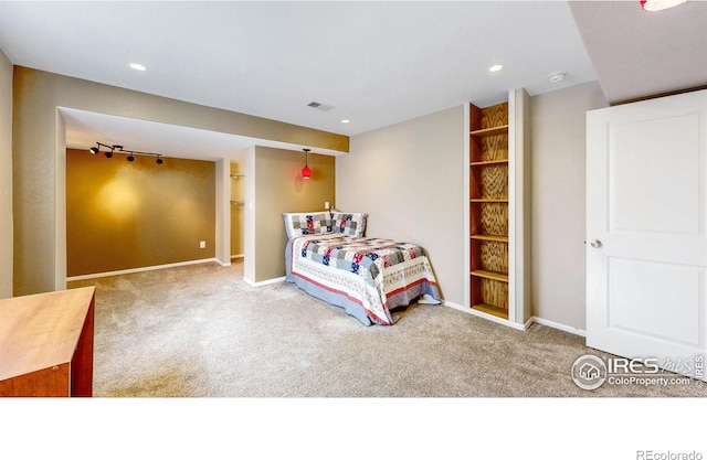 carpeted bedroom featuring recessed lighting, visible vents, and baseboards