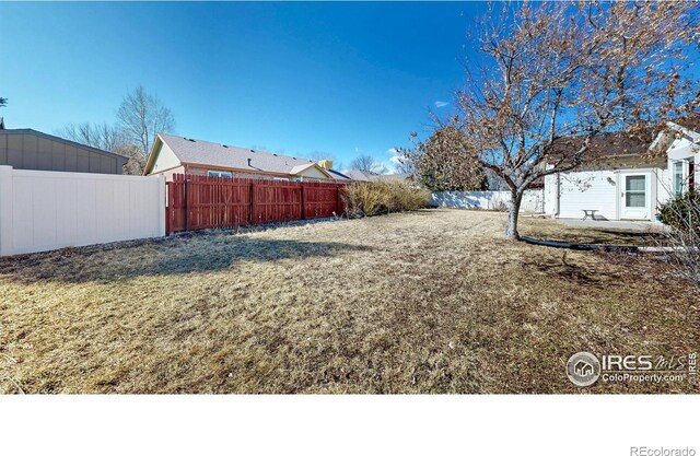 view of yard featuring a fenced backyard