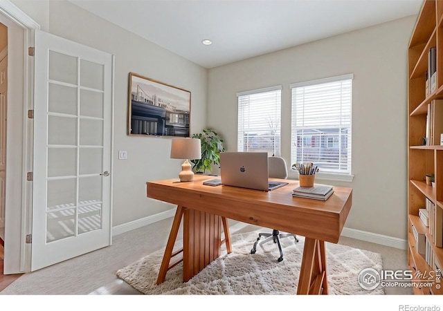 office space with recessed lighting and baseboards