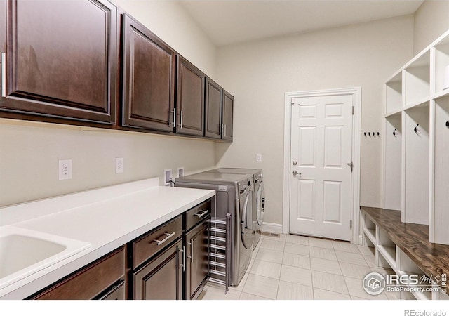 laundry room with cabinet space and washing machine and clothes dryer