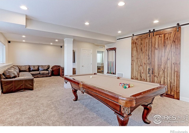 rec room featuring carpet flooring, visible vents, and a barn door