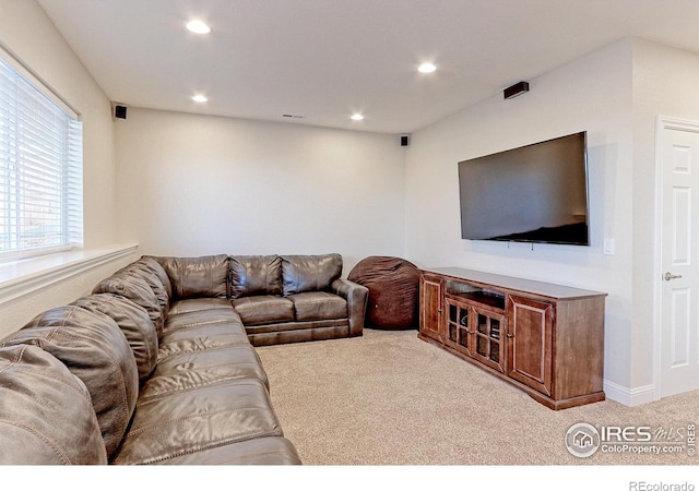 carpeted living room featuring recessed lighting