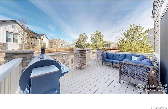 deck featuring outdoor lounge area and a residential view