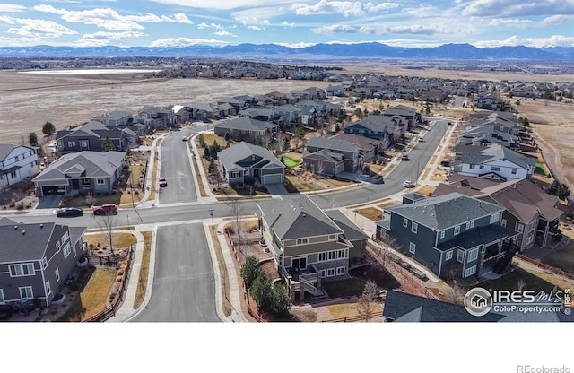 bird's eye view with a residential view and a mountain view