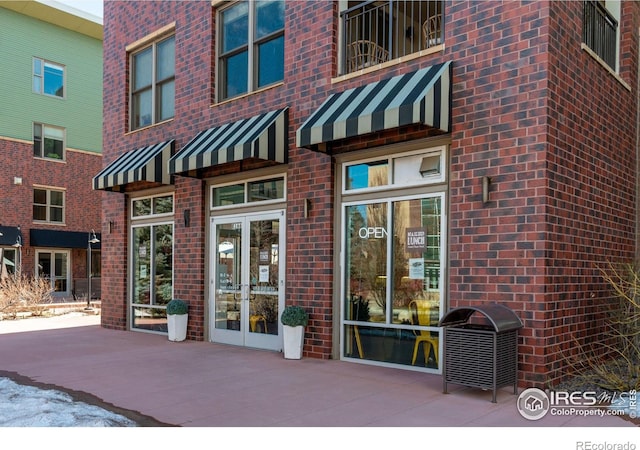 entrance to property with brick siding