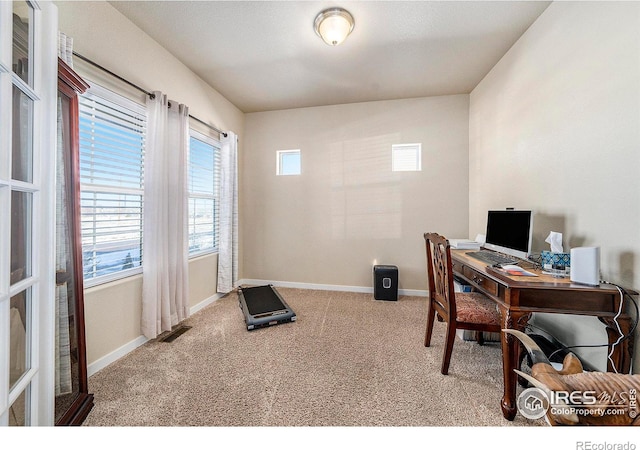 home office with carpet floors, visible vents, and baseboards