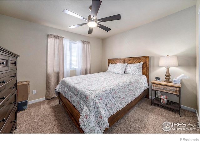 bedroom with a ceiling fan, baseboards, and carpet flooring