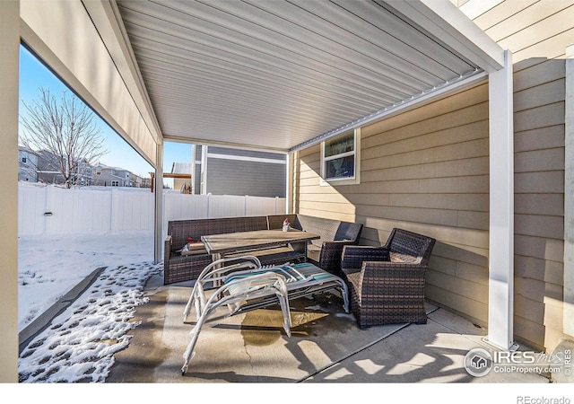 view of patio / terrace featuring outdoor lounge area and fence