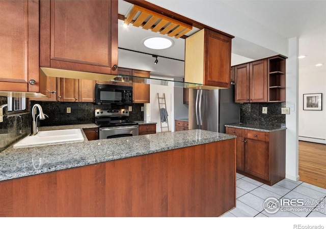 kitchen featuring stainless steel appliances, stone counters, a sink, and open shelves