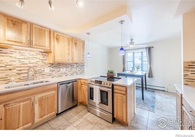 kitchen featuring light brown cabinets, appliances with stainless steel finishes, a baseboard radiator, and a sink