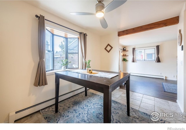 office area with plenty of natural light, baseboard heating, and tile patterned floors