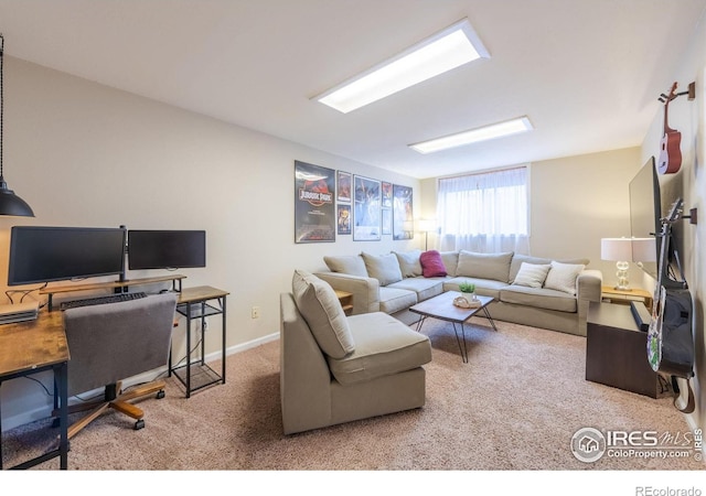 carpeted living room featuring baseboards