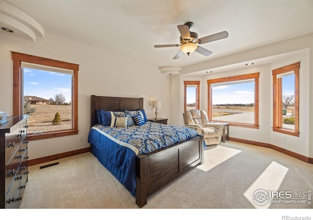 bedroom with carpet, visible vents, ceiling fan, and baseboards