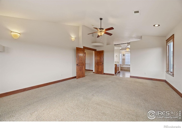 interior space with recessed lighting, light colored carpet, a ceiling fan, visible vents, and baseboards