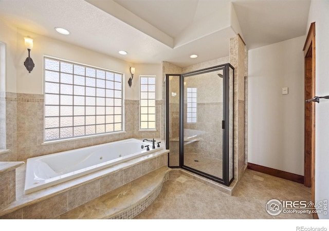 bathroom featuring a stall shower, tile patterned floors, a jetted tub, and recessed lighting