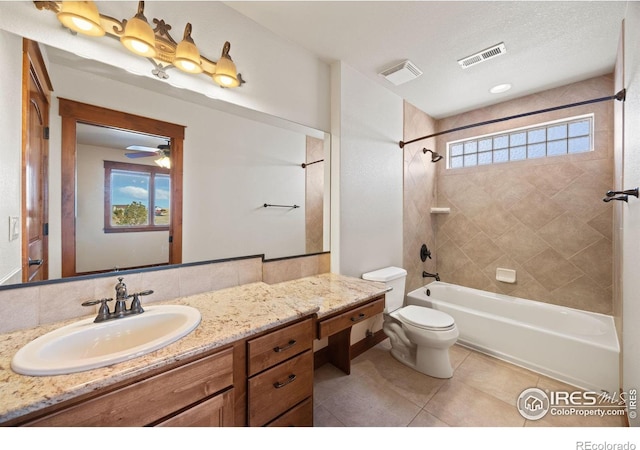 full bathroom featuring toilet, vanity, tile patterned flooring, and visible vents