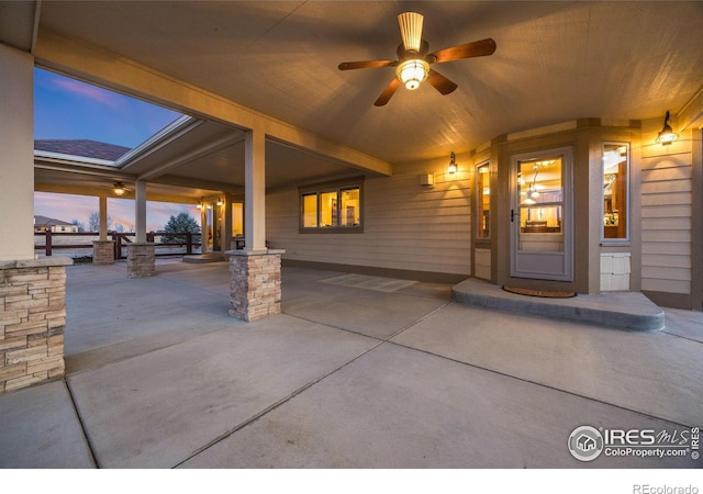 view of patio featuring ceiling fan