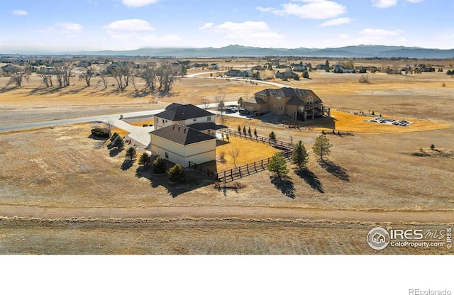 bird's eye view featuring a rural view and a mountain view