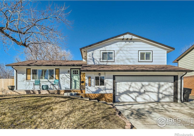 view of front facade with a garage, covered porch, brick siding, concrete driveway, and a front yard