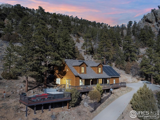 birds eye view of property with a wooded view