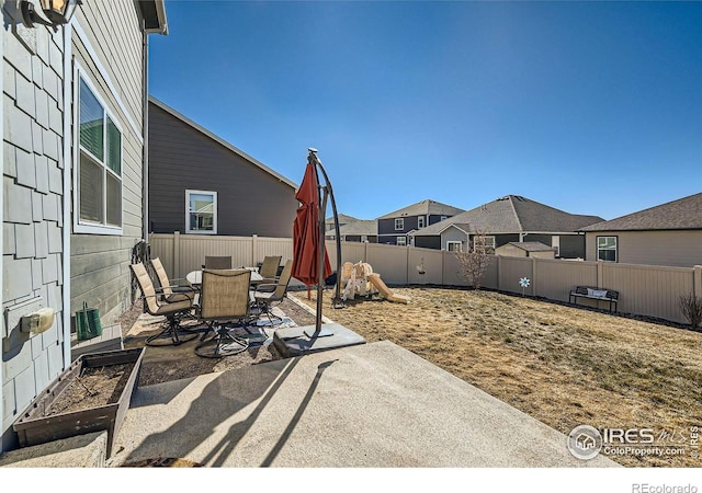 view of patio / terrace featuring outdoor dining area and a fenced backyard