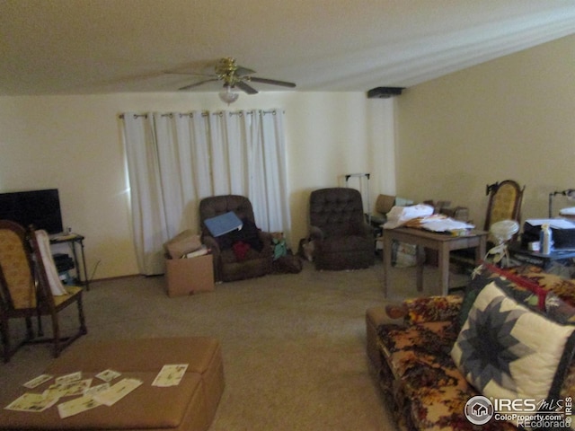 carpeted living room featuring ceiling fan