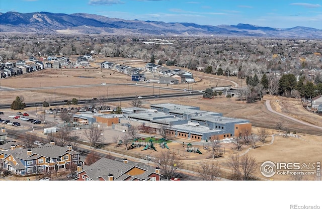 birds eye view of property with a residential view and a mountain view