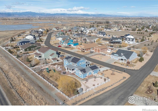 drone / aerial view with a residential view and a mountain view